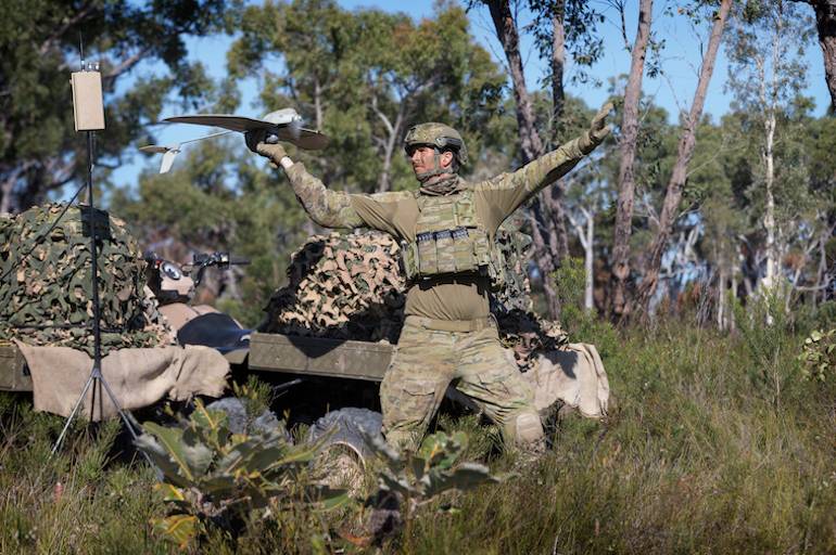 Lance Bombardier Jarrod Logan, launches a Wasp unmanned aerial system