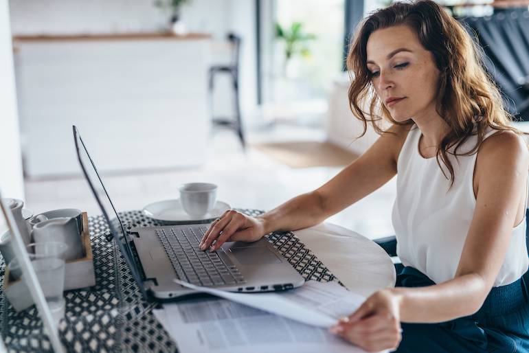 Businesswoman working on laptop.