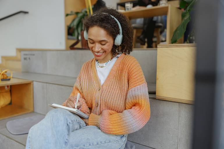 Smiling woman wearing headphones