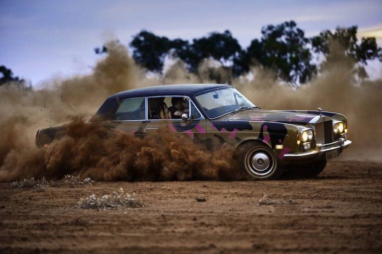 Airwallex and McLaren have teamed up with the Aboriginal artist who did burnouts in a Rolls-Royce for the Melbourne F1